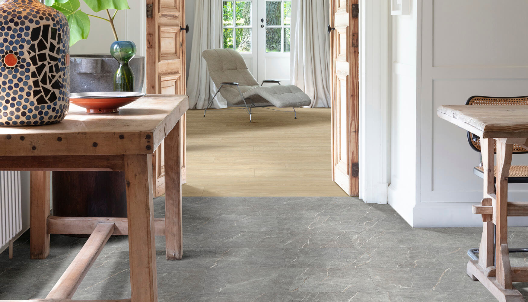 Stone effect LVT flooring in one room and wood effect LVT flooring in the next room. Seamless transition.